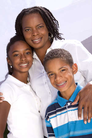 Happy African American mother and her children.の写真素材