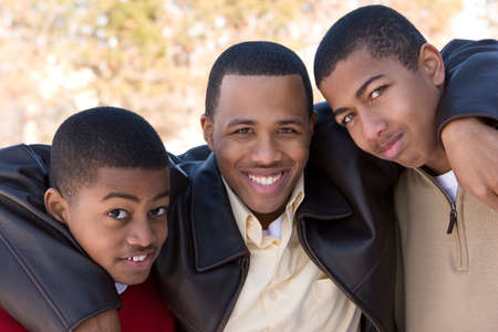 Portrait of African American teenage brothers smiling.の写真素材