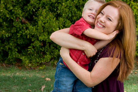 Portrait of a mother and son hugging.の写真素材