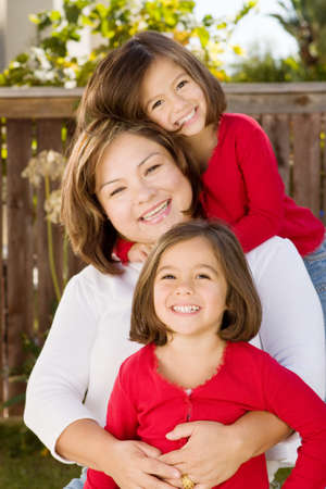 Happy Hispanic mother and her daughter.の写真素材