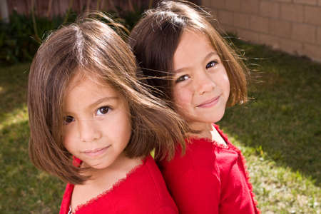 Portrait of a happy Hispanic little girl smiling.の写真素材