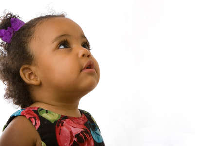 Little girl smiling isolated on white.の写真素材