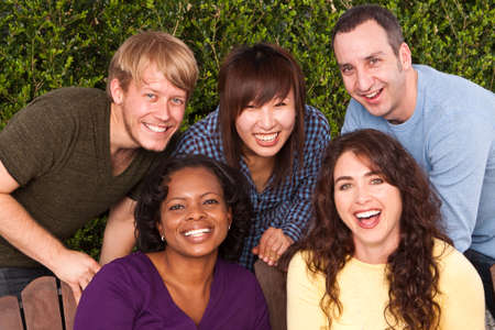 Diverse group of friends sitting outside.