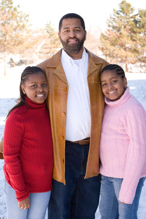 African American father and his young daughters.の写真素材