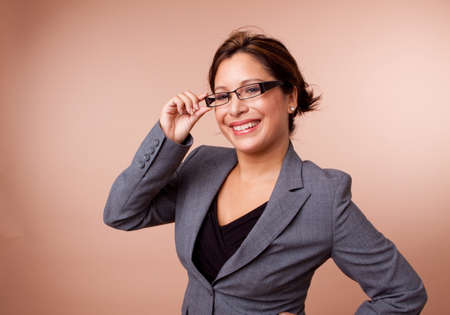 Hispanic businesswoman isolated on a background.の写真素材
