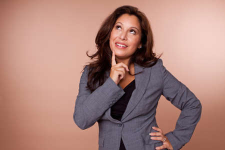 Beautiful Hispanic woman smiling and looking up.