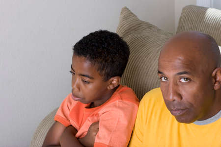 African American father having difficulty parenting his son.の写真素材