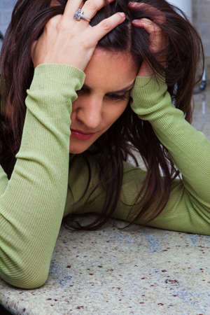 Unhappy woman looking stressed and sad.