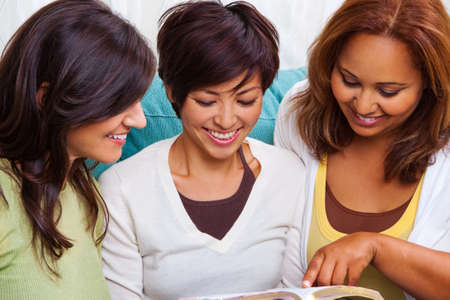 Diverse group of women reading and talking.の写真素材