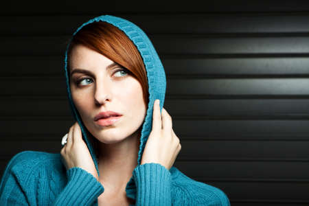 Beautiful young woman in a blue sweater.