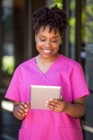 Woman standing outside an office buildingの写真素材