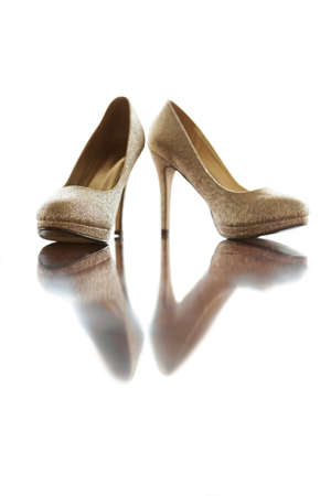 Light gold shoes isolated on a white background.の写真素材