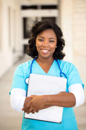 Healthcare worker. Doctor or nurse standing outside the hospital.の写真素材
