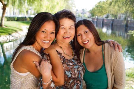 Asian mother and her adult daughters.の写真素材