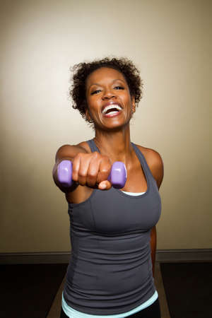 African American woman lifting weights.の写真素材