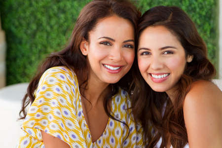 Beautiful Hispanic women smiling outside.の写真素材
