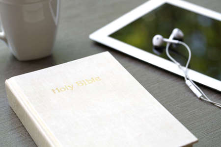Christian background of a Bible and tablet.の写真素材