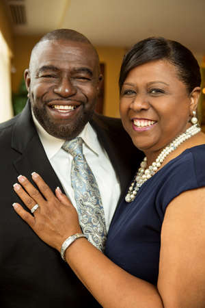 Afrian American couple laughing and smiling.の写真素材