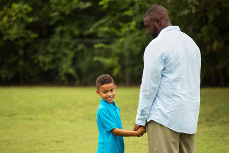 Father and son playing outside.の写真素材