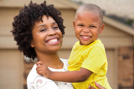 Young African American mother playing and her son.の写真素材