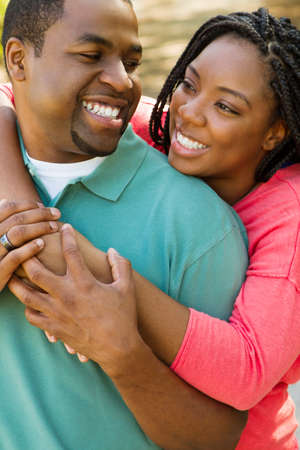 Beautiful happy couple smiling outside.