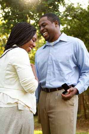 Young man proposing to his girlfriend.