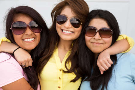 Sisters laughing and having fun outside.の写真素材