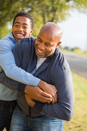 Father and son playing football.