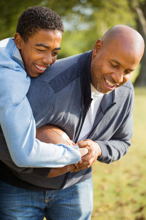 Father and son playing football.の写真素材
