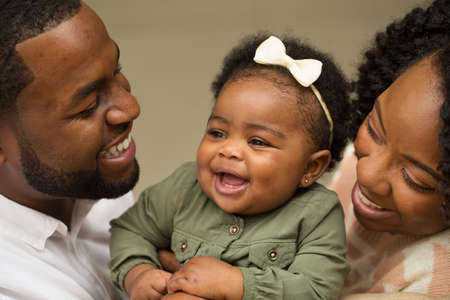 Happy African American family with their baby.の写真素材