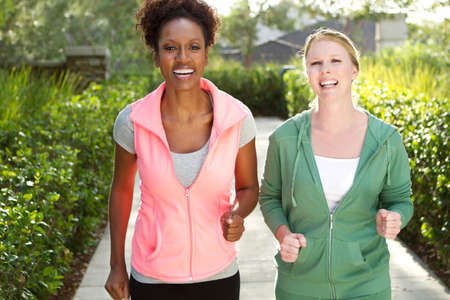 Friends talking and exercising.の写真素材