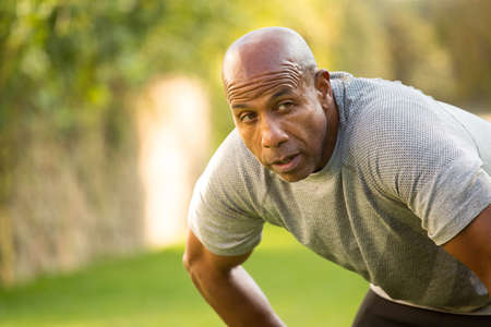 Fit African American man lifting weightsの写真素材