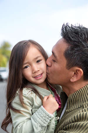 Asian father with his daughter.の写真素材