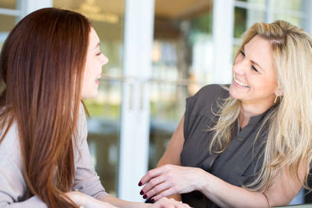 Two women taling and laughing.の写真素材