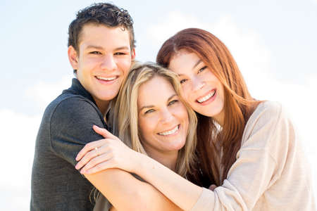 Latin mother and her teenage children.の写真素材