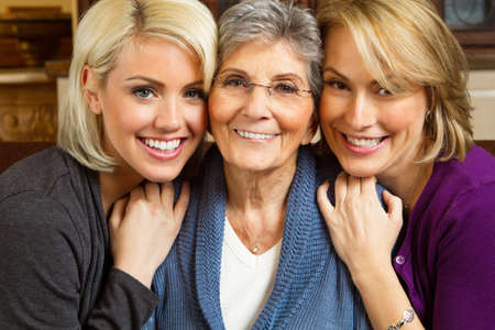 Granddaughter helping her grandmoter on the computer.の写真素材