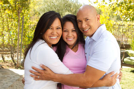 Happy Asian Family Huggingの写真素材