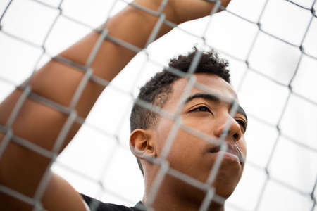 Young teenage boy in deep thought.の写真素材