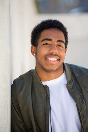 African American teenage boy smiling.