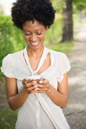 Beautiful woman smiling outside.の写真素材