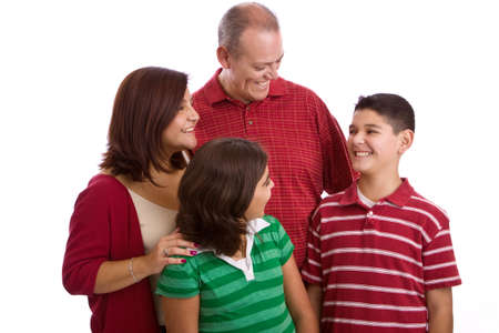 Hispanic family smiling isolated on white.の写真素材