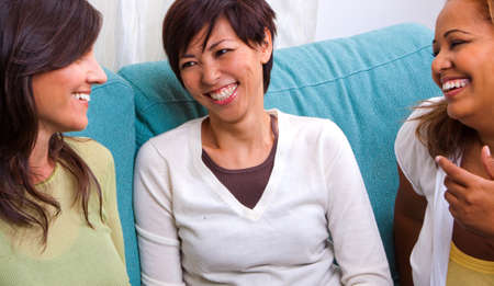 Diverse group of women talking and laughing.の写真素材
