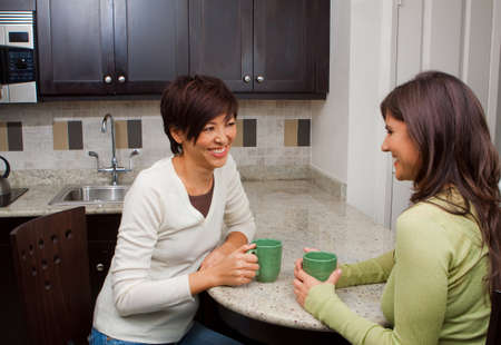 Diverse group of women talking and laughing.の写真素材