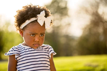 African American little girl with a mad expression.の写真素材