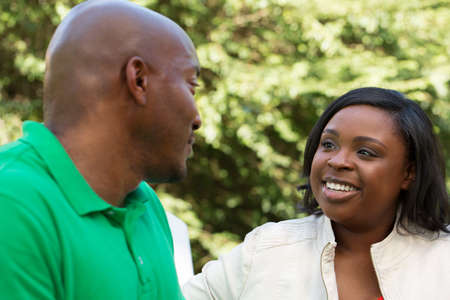 African American Couple talking and laughing.の写真素材