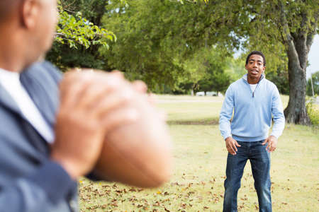 Father and son playing football.の写真素材