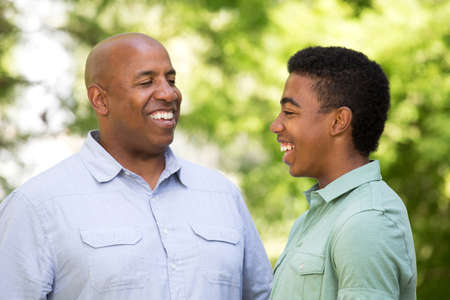 African American father and teen son.の写真素材
