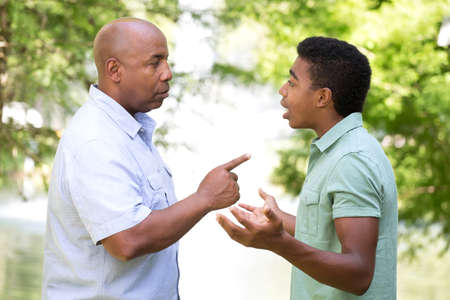 Father and son having a serious conversation.の写真素材