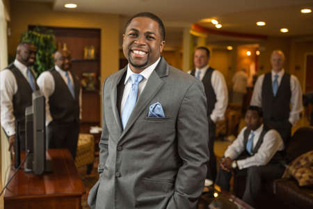 African American groom and groomsmen smiling.の写真素材