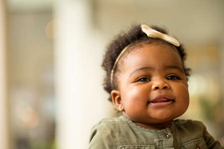 Portrait of a happy little girl laughing and smiling.の写真素材